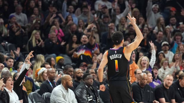 Phoenix Suns guard Devin Booker (1) reacts against the Orlando Magic during the second half at Footprint Center.